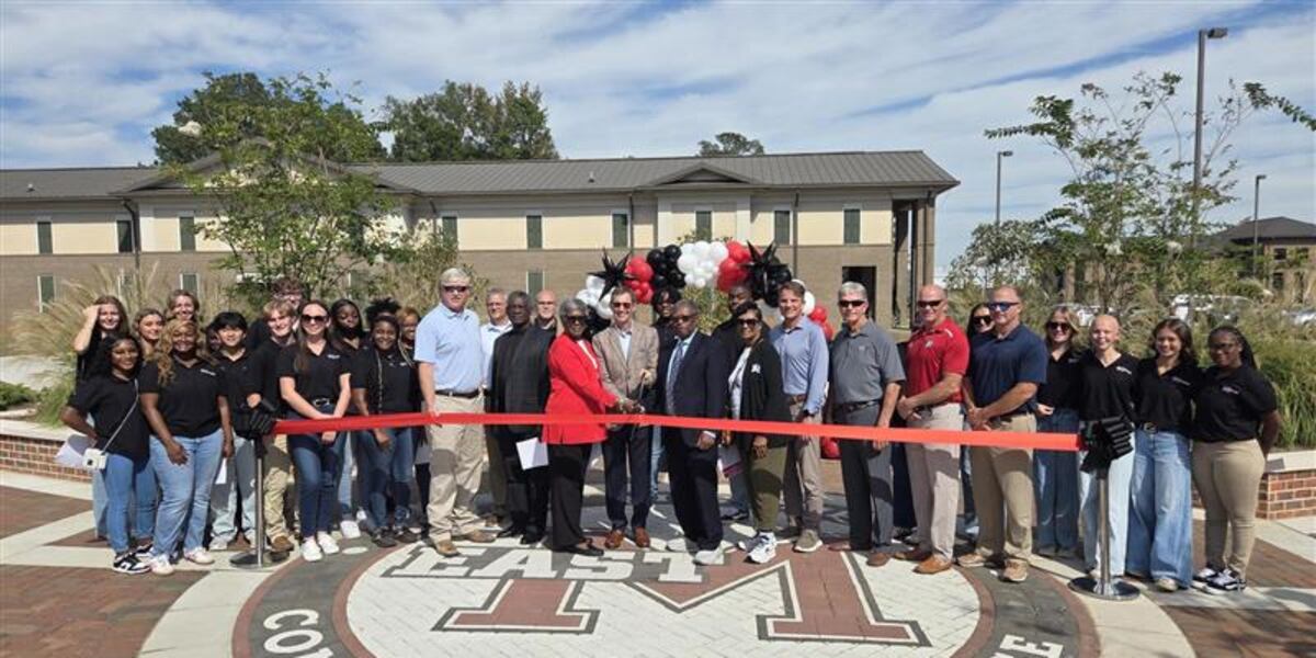 Infrastructure Ribbon EMCC cuts ribbon on new sidewalk infrastructure project