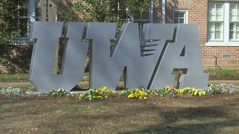A sign reading "UWA" on the campus of the University of West Alabama in Livingston, Ala.