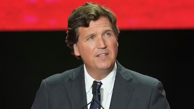 FILE - Tucker Carlson speaks at a memorial for Charlie Kirk, Sept. 21, 2025, in Glendale,...