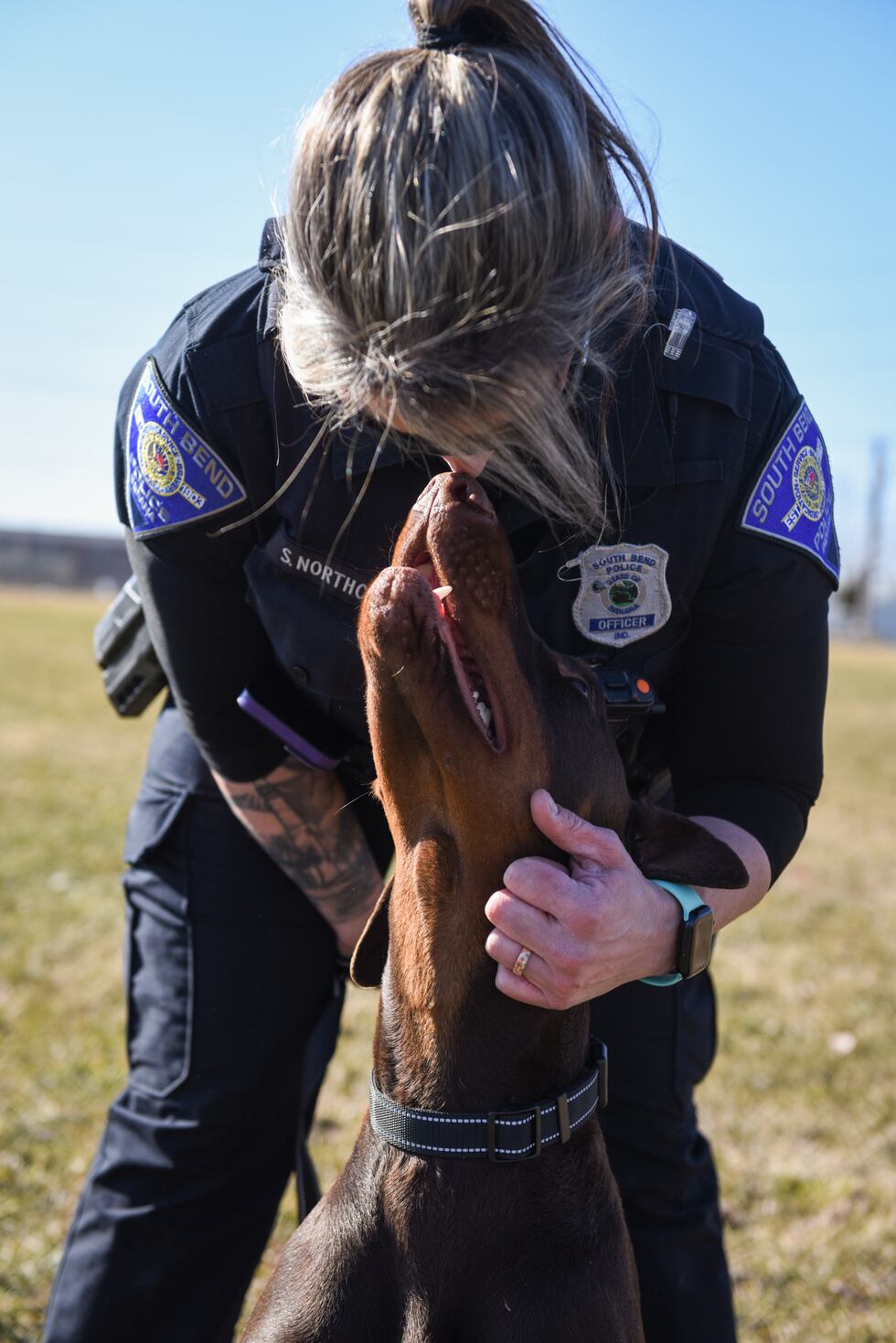 Dog found with zip-tied snout gets adopted by police officer who
