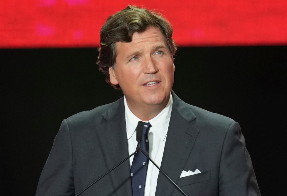 FILE - Tucker Carlson speaks at a memorial for Charlie Kirk, Sept. 21, 2025, in Glendale,...